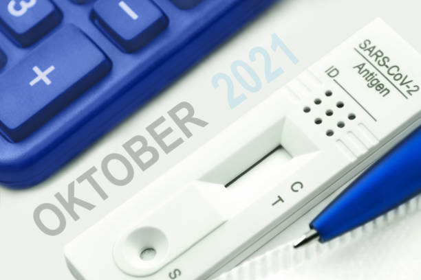 istock Corona Antigen Test and German calendar October 2021 with calculator 1335562904