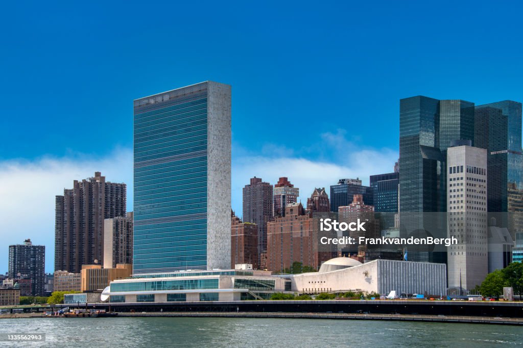 United Nations building in New York New York Skyline seen over the East River from Roosevelt Island with United Nations building. United Nations Building Stock Photo