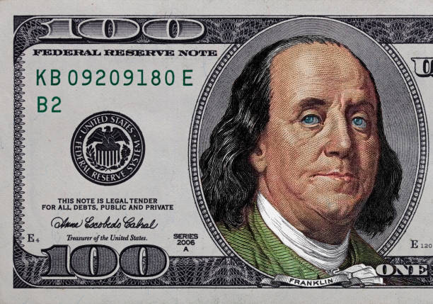 istock fragment of old colorized  dollar 1335564236
