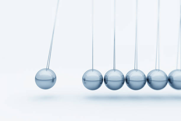 istock Newton cradle metallic balls 1335564935