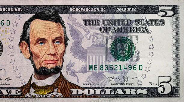 istock fragment of old colorized  dollar 1335565235
