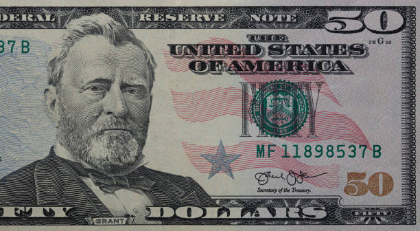 istock fragment of old colorized  dollar 1335565237