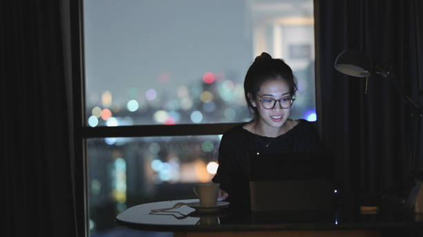 istock New normal business Asian cheerful enjoy learning business planning self study doing working at home using laptop online e-commerce business at her house 1335565268