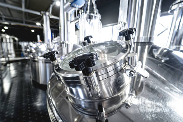 istock Craft beer brewing equipment in privat brewery 1335565326