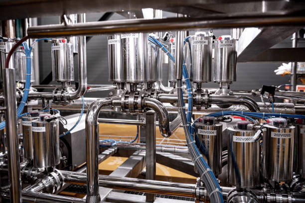 istock Pipes and fittings at a craft modern brewery 1335566148