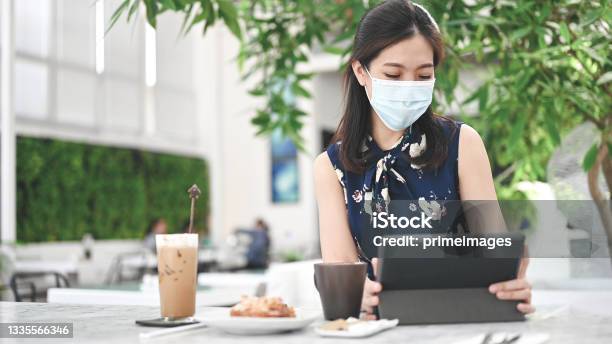 New Norm Working At Cafe With Facemask Stock Photo - Download Image Now - 20-29 Years, 25-29 Years, Adult