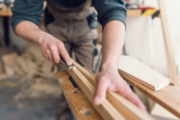 istock Professional carpenter grinding wooden lath 1335568726