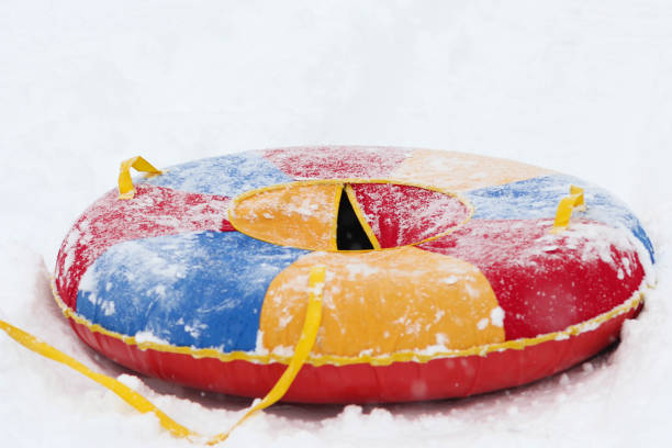 istock Multicolor tube on snow in winter time 1335568977