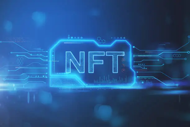 Photo of Creative NFT chip hologram on blue background. Non-fungible token and cryptocurrency concept. 3D Rendering.