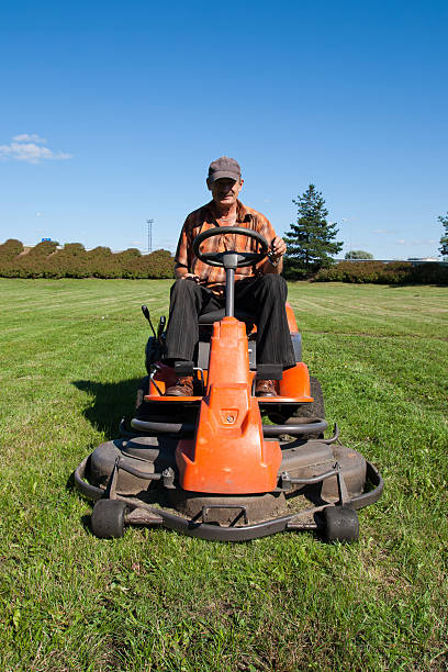 istock Mature man driving grass cutter 133559129