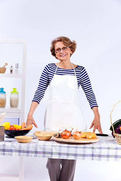 istock Senior woman cooking 133559225