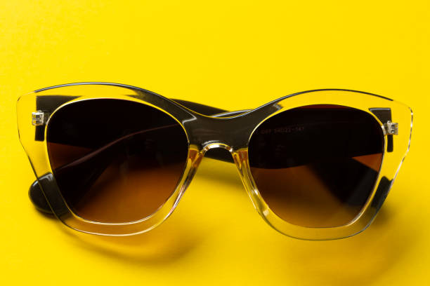 istock Sunglasses on a yellow background. UV protection. 1335629201