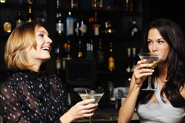 istock Two Young Women Drinking Martinis in Bar 133563443