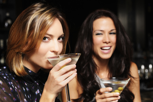 Two Young Women Drinking Martinis in Bar