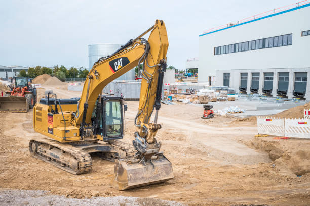 Sunrise view of yellow Excavator in a new road construction