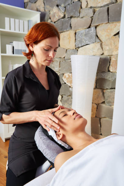 istock Head massage woman with physiotherapist 1335647769