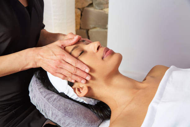 istock Head massage woman with physiotherapist 1335650394