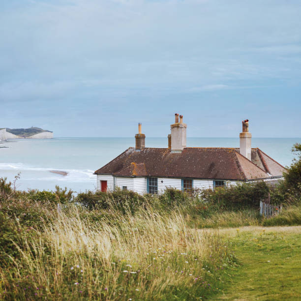 Seaford, England - August 01, 2021: Cuckmere Haven is an area of flood plains in Sussex, England where the river Cuckmere meets the English Channel between Eastbourne and Seaford.