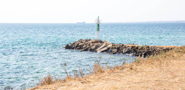 istock lighthouse near a sea in a Greek town 1335656588