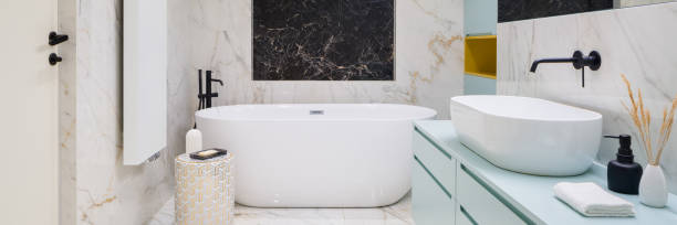 istock Elegant bathroom with big freestanding bathtub, panorama 1335661097