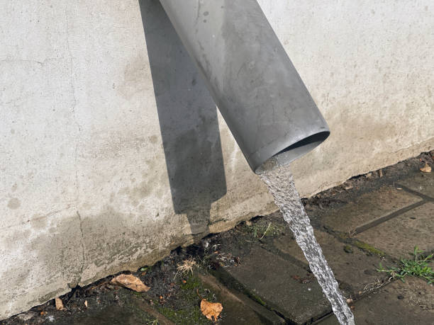 istock Gutter pipe line after rain with water drainage. drain pipe 1335661405