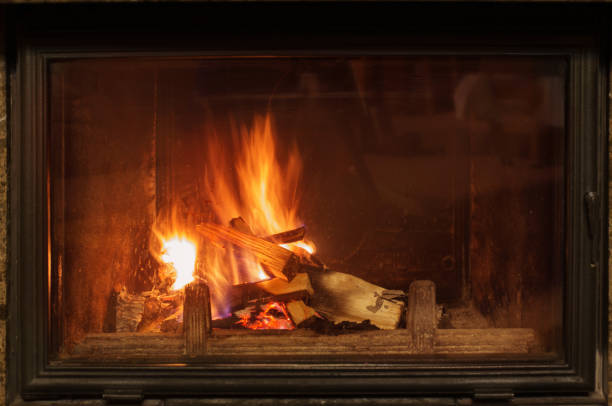 istock dark fireplace with burning wood 1335667805