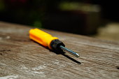 Old crosshead screwdriver  yellow