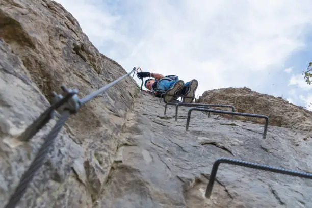 mountain climbing extreme sport in nature via ferrata