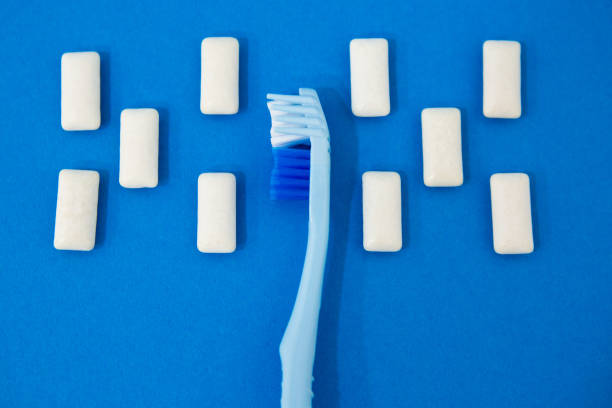 istock Blue toothbrushes on a blue background. Protecting teeth from caries. 1335672644