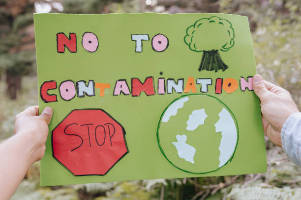 istock hands holding a banner of caring for the environment nature 1335673634