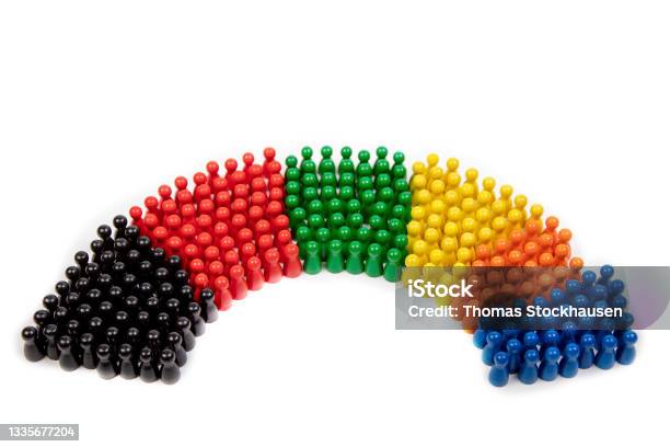 Wooden Figurines In The Colors Of German Political Parties And The Rotunda Of The German Parliament Stock Photo - Download Image Now