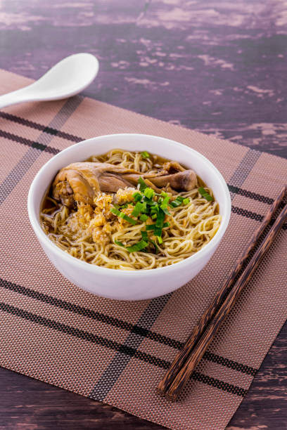 istock Noodle soup with chicken street food 1335677355