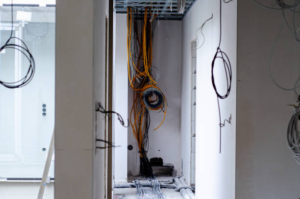 istock Electric installation work. Pulling wires in an unfinished house 1335680001