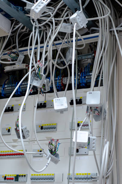 istock Electric installation work. Connecting wires to the switchboard 1335680129