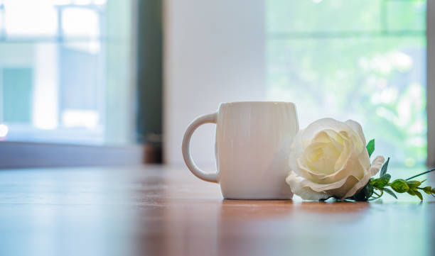istock white mug and creamy  rose 1335682551