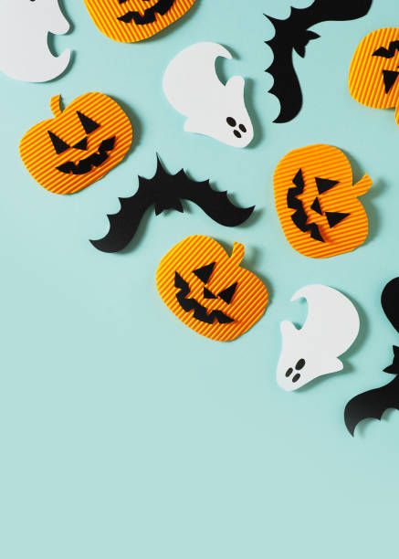 istock Halloween party concept with fun paper decor, pumpkins, ghost 1335682771