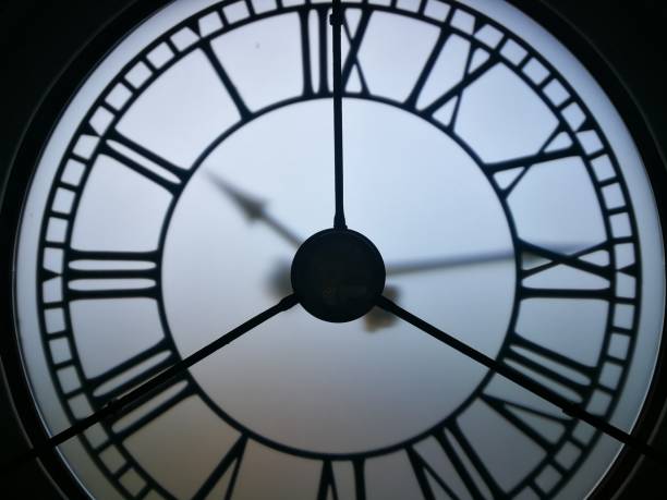 istock Close up of black and white clock 1335683113