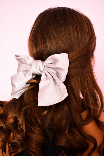 istock Woman indoors with a silver hair how 1335683137