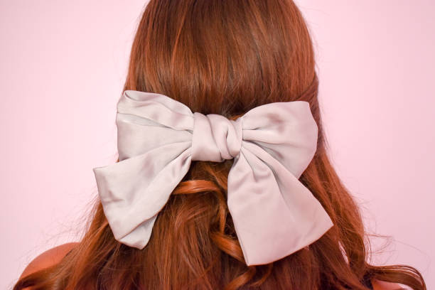 istock Woman indoors with a silver hair how 1335683143