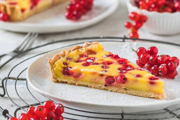istock Piece of homemade red currant pie on white background 1335683287