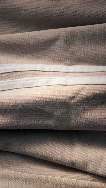 istock Side white lines in beige cotton tracksuit 1335688007