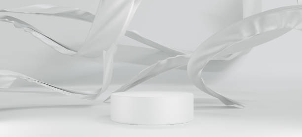 istock Abstract metallic white cloth flying,levitating on white background,cylinder premium podium for mockup product placement and cosmetic beauty, pedestal luxury show,marketing present stage ,3d render 1335688866
