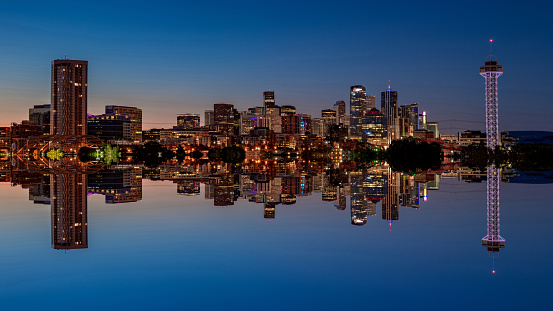 Night over and under the city of Denver as an abstract mirror image