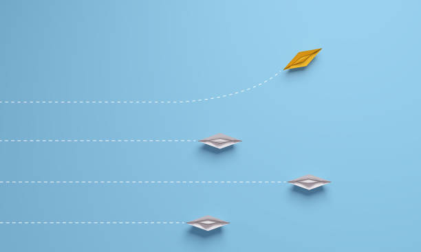 istock Individual and unique leader yellow paper ship changing direction. 1335691322