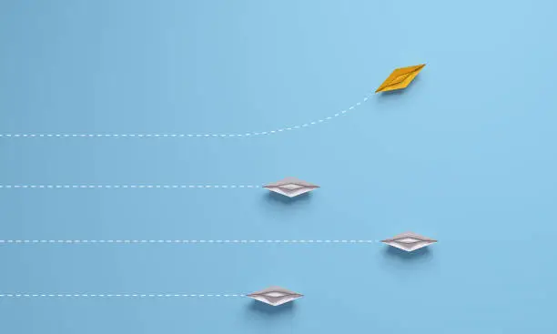 Individual and unique leader yellow paper ship changing direction on top view. 3d rendering.