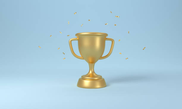 istock Golden trophy cup with falling confetti on blue background. 1335691323