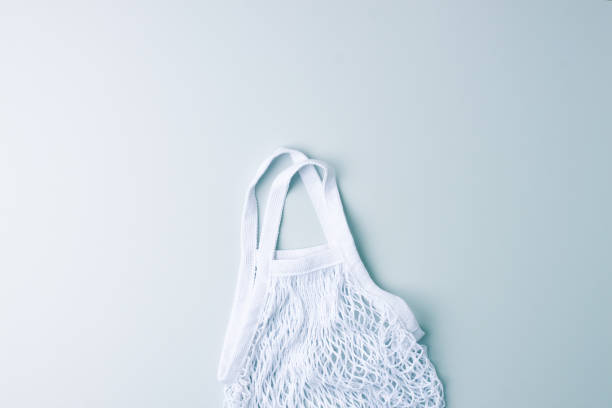 istock Zero waste, sustainable and eco-friendly lifestyle. Basket on grey background. Flat lay, copy space 1335694119