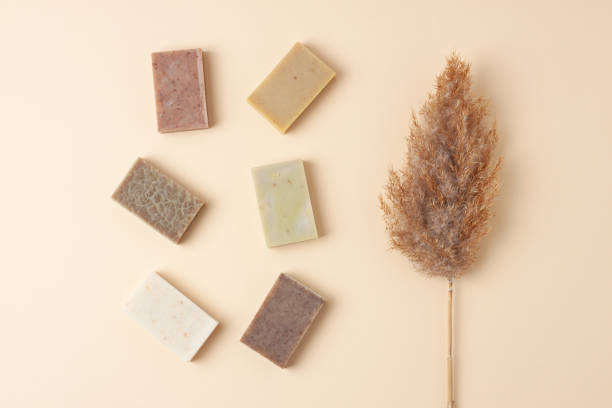 istock Soap with flowers on pastel beige background. Flat lay, copy space. 1335695206