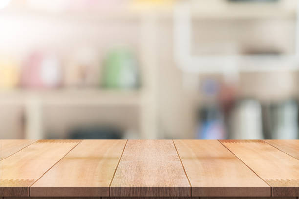istock Empty wooden table top with lights bokeh on blur restaurant background. 1335695403