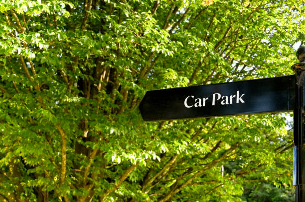 istock Sign pointing to a car park 1335697126